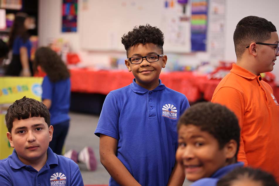students and teacher working in classroom