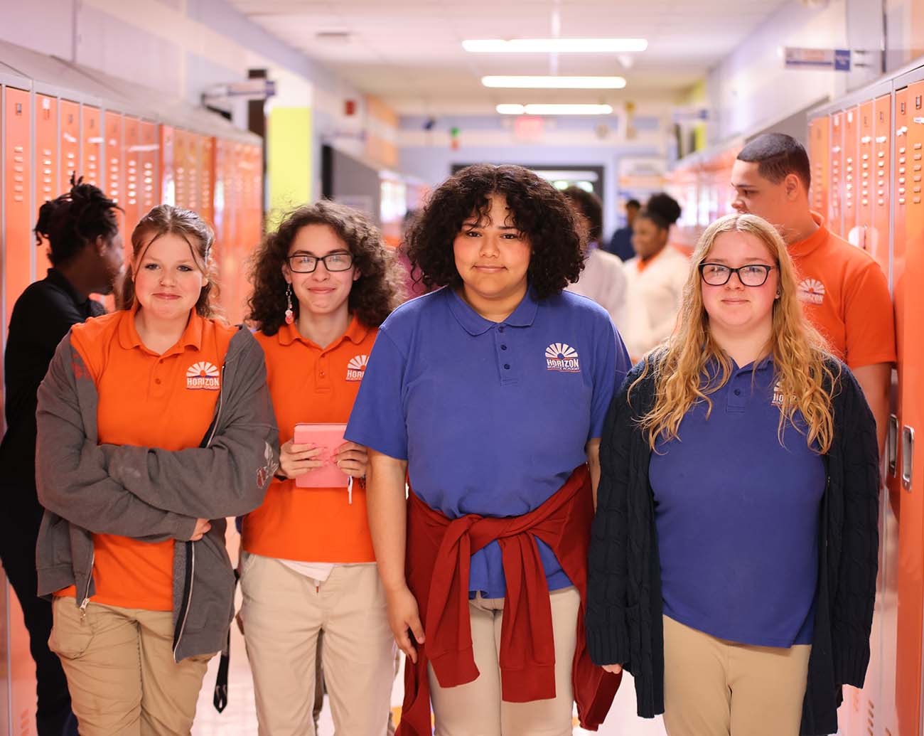 Teacher or school staff member warmly interacting with a student outside