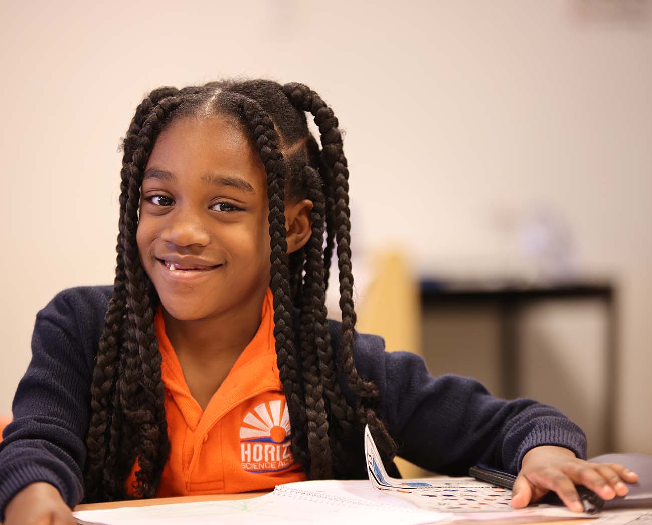 Smiling children together outdoors.